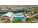 An aerial view of the community pool, playground and clubhouse by the lake at 23042 E Excelsior Ave, Queen Creek, AZ 85142