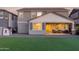 A lovely backyard features synthetic grass, patio, playhouse, and offers a great space for outdoor enjoyment and entertaining at 23042 E Excelsior Ave, Queen Creek, AZ 85142