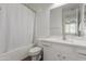 Bathroom features a shower/tub combo, tile surround, and white vanity with ample storage at 23042 E Excelsior Ave, Queen Creek, AZ 85142