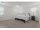 Bright primary bedroom with neutral carpet features ample natural light and a calming atmosphere at 23042 E Excelsior Ave, Queen Creek, AZ 85142