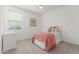 Comfortable bedroom with natural light, a warm rug, and neutral decor at 23042 E Excelsior Ave, Queen Creek, AZ 85142