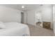 Spacious primary bedroom offers neutral tones, carpeted floors, and access to the ensuite bathroom at 23042 E Excelsior Ave, Queen Creek, AZ 85142