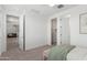 Bright bedroom offering neutral walls and carpet along with multiple entryways at 23042 E Excelsior Ave, Queen Creek, AZ 85142