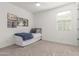Inviting bedroom with window, artwork, and twin bed, offering a relaxing space at 23042 E Excelsior Ave, Queen Creek, AZ 85142
