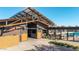 Exterior view of community clubhouse with pool access and relaxing outdoor seating areas at 23042 E Excelsior Ave, Queen Creek, AZ 85142