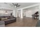 Bright living space with hardwood floors, view into the kitchen, and natural light at 23042 E Excelsior Ave, Queen Creek, AZ 85142