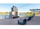Stylish lakeside outdoor lounge with modern fireplace and comfortable seating at 23042 E Excelsior Ave, Queen Creek, AZ 85142