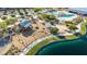 Aerial view of a community playground and pool area with water tower and recreational spaces at 23042 E Excelsior Ave, Queen Creek, AZ 85142