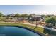 Charming community playground on the edge of the lake, with walkways and natural elements at 23042 E Excelsior Ave, Queen Creek, AZ 85142