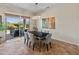 Dining room with sliding glass doors leading to a covered patio and backyard views at 26484 W Mohawk Ln, Buckeye, AZ 85396