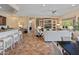 This expansive living room seamlessly connects to the kitchen, enhancing the flow of the main living space at 26484 W Mohawk Ln, Buckeye, AZ 85396