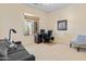 Functional home office space with a desk, chair, and natural light from the window at 26484 W Mohawk Ln, Buckeye, AZ 85396