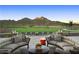 Comfortable outdoor seating area with stunning mountain views, creating a perfect spot for relaxation and socializing at 26484 W Mohawk Ln, Buckeye, AZ 85396