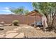 Inviting backyard retreat with pergola, stone pavers, gravel, and comfortable lounge chairs, offering a relaxing outdoor space at 3026 W Silver Fox Way, Phoenix, AZ 85045