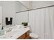 Well-lit bathroom featuring a large mirror, white shower curtain, and neutral-toned vanity, creating a clean and inviting space at 3026 W Silver Fox Way, Phoenix, AZ 85045