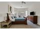 Comfortable bedroom with wood furniture and ample natural light at 3026 W Silver Fox Way, Phoenix, AZ 85045