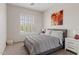 Serene bedroom with gray comforter, window shutters, and decorative art at 3026 W Silver Fox Way, Phoenix, AZ 85045