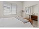 Bright bedroom featuring a sliding mirror closet door at 3026 W Silver Fox Way, Phoenix, AZ 85045