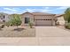 Inviting single-story home with a tile roof, two car garage and low-maintenance desert landscaping at 3026 W Silver Fox Way, Phoenix, AZ 85045