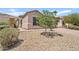 Desert landscaping and a beautiful stone pillar accentuates the front exterior of this single story home at 3026 W Silver Fox Way, Phoenix, AZ 85045