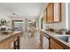 Bright, open kitchen and dining area with granite countertops and modern appliances at 3026 W Silver Fox Way, Phoenix, AZ 85045
