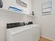 Functional laundry room with washer and dryer, convenient shelving, and a window providing natural light at 3026 W Silver Fox Way, Phoenix, AZ 85045