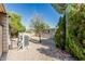 Exterior view of the backyard with gravel, plants, A/C unit, and house at 3239 E Kings Ave, Phoenix, AZ 85032