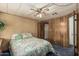 Bedroom featuring a comfortable bed, neutral walls, and convenient access to an ensuite bathroom at 3239 E Kings Ave, Phoenix, AZ 85032