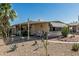 Relaxing home exterior features a covered patio and desert landscaping at 3239 E Kings Ave, Phoenix, AZ 85032