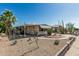 Relaxing home exterior features a covered patio and desert landscaping at 3239 E Kings Ave, Phoenix, AZ 85032