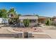 Charming single-story home featuring desert landscaping and covered parking at 3239 E Kings Ave, Phoenix, AZ 85032