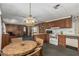 Cozy dining area blending seamlessly into a functional kitchen with essential appliances and wood cabinets at 3239 E Kings Ave, Phoenix, AZ 85032