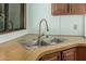 Modern double-bowl sink with a sleek faucet, set against light countertops and wooden cabinets at 3239 E Kings Ave, Phoenix, AZ 85032