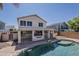 View of the two story home overlooking the refreshing pool and outdoor entertaining space at 3282 S Warner Dr, Apache Junction, AZ 85120