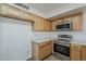 Well-lit kitchen with oak cabinets and stainless steel appliances at 3282 S Warner Dr, Apache Junction, AZ 85120