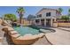 Resort-style pool with grotto, waterslide and tanning shelf provides a backyard oasis for relaxation and entertainment at 3282 S Warner Dr, Apache Junction, AZ 85120