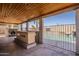 Outdoor living area featuring a stone outdoor kitchen, barbecue and a sparkling pool with a small waterfall at 3282 S Warner Dr, Apache Junction, AZ 85120