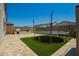 Backyard with a trampoline and built-in barbecue, perfect for outdoor fun and entertaining at 3715 S 57Th Ln, Phoenix, AZ 85043