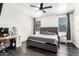 Modern bedroom featuring a tufted headboard, sleek gray bedding, and stylish decor at 3715 S 57Th Ln, Phoenix, AZ 85043