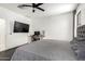 Comfortable bedroom featuring a work desk area and a ceiling fan at 3715 S 57Th Ln, Phoenix, AZ 85043