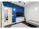 Bedroom featuring a blue accent wall, modern decor, and a ceiling fan at 3715 S 57Th Ln, Phoenix, AZ 85043