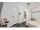 White-walled bedroom featuring a quaint bed frame and tasteful decorative accents at 3715 S 57Th Ln, Phoenix, AZ 85043