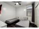 Guest bedroom featuring twin beds, dark trim, and closet at 3715 S 57Th Ln, Phoenix, AZ 85043