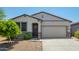 Charming single-story home featuring a two-car garage, neutral stucco, desert landscaping and a welcoming front door at 3715 S 57Th Ln, Phoenix, AZ 85043