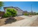 Charming single-story home featuring a two-car garage, neutral stucco, desert landscaping, and a welcoming front door at 3715 S 57Th Ln, Phoenix, AZ 85043