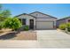 Charming single-story home featuring a two-car garage, neutral stucco, desert landscaping and a welcoming front door at 3715 S 57Th Ln, Phoenix, AZ 85043