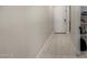 Inviting hallway with wood-look tile flooring and a view of the front door at 3715 S 57Th Ln, Phoenix, AZ 85043