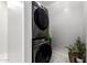 Efficient laundry area with stacked washer and dryer, maximizing space and convenience at 3715 S 57Th Ln, Phoenix, AZ 85043