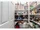 Well-stocked pantry with ample shelving for food storage and organization, door ajar at 3715 S 57Th Ln, Phoenix, AZ 85043