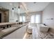 Elegant bathroom featuring double sinks, pendant lighting, and a soaking tub at 37200 N Cave Creek Rd # 1045, Scottsdale, AZ 85262